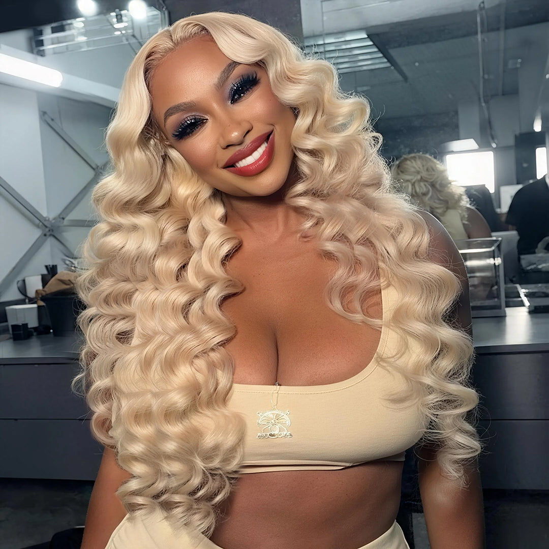 300% density #613 blonde bouncy wavy human hair lace front wig with transparent lace, natural hairline and full voluminous waves