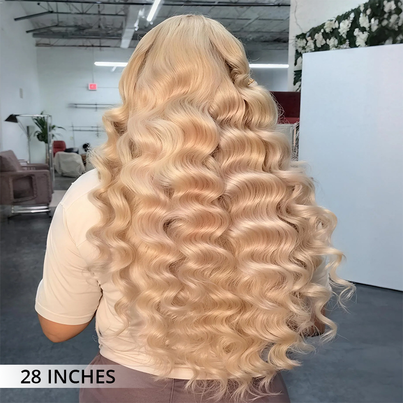 #613 blonde human hair wig with 300% density, transparent lace front, soft bouncy waves and a naturally blended hairline